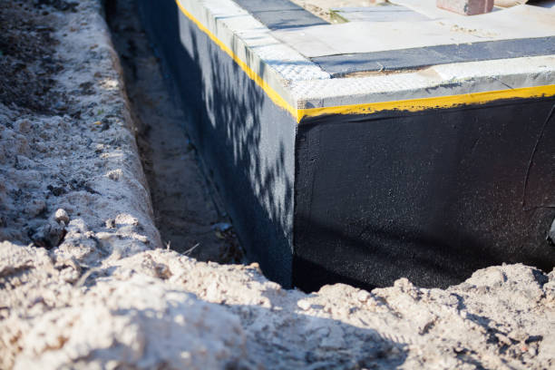 Professional Waterproofing technician working in Pennville, IN